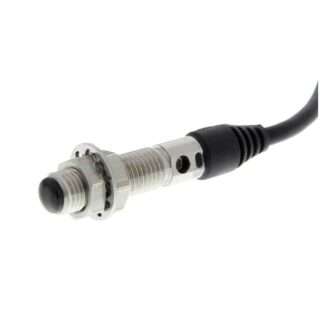 Inductive proximity sensor with a threaded metal body and attached cable for mounting in equipment