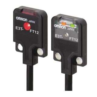 Two Omron E3T FT12 photoelectric sensors with red and green status LEDs on black cables.