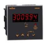 SELEC EM306 power meter with red LED display showing 3009.94 kWh and orange control indicators, plus four navigation buttons.